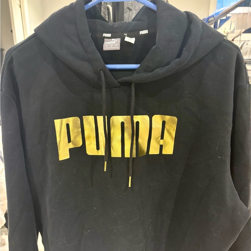PUMA Women’s Black Sweater with Gold Logo